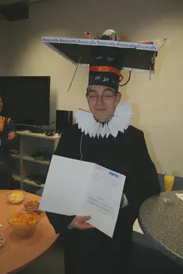 Oscar and his doctoral certificate.